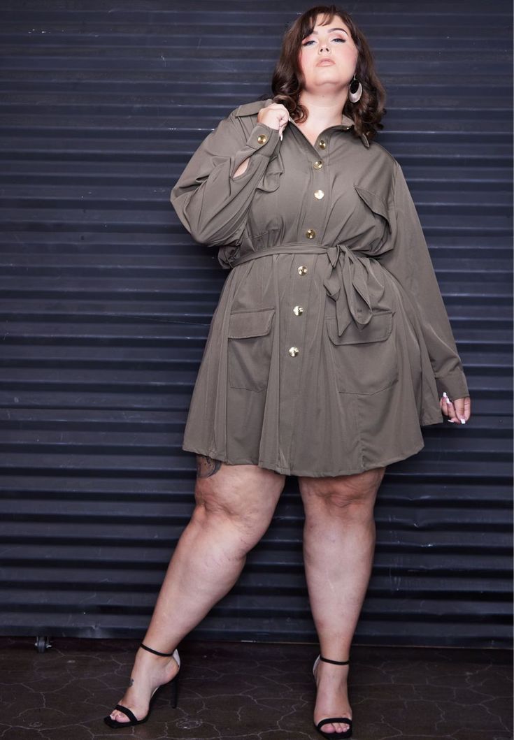 Fit Model is 5'9 and wearing a 2X.?ÿDress?ÿlength is 39" on size 2X?ÿ Weƒ??re pulling out all the stops! Our Charly Trench Dress is your go to piece when you wanna get ƒ??em talking. From the military-styled pockets, to the bright gold buttons, to the sashed waist, to the popped collar; the flair of our Charly Trench D Dress For Chubby Ladies, Popped Collar, Cute Tights, Affordable Plus Size Clothing, Ferrari F12, Trench Dress, Preppy Dresses, Coat Style, Tights And Boots