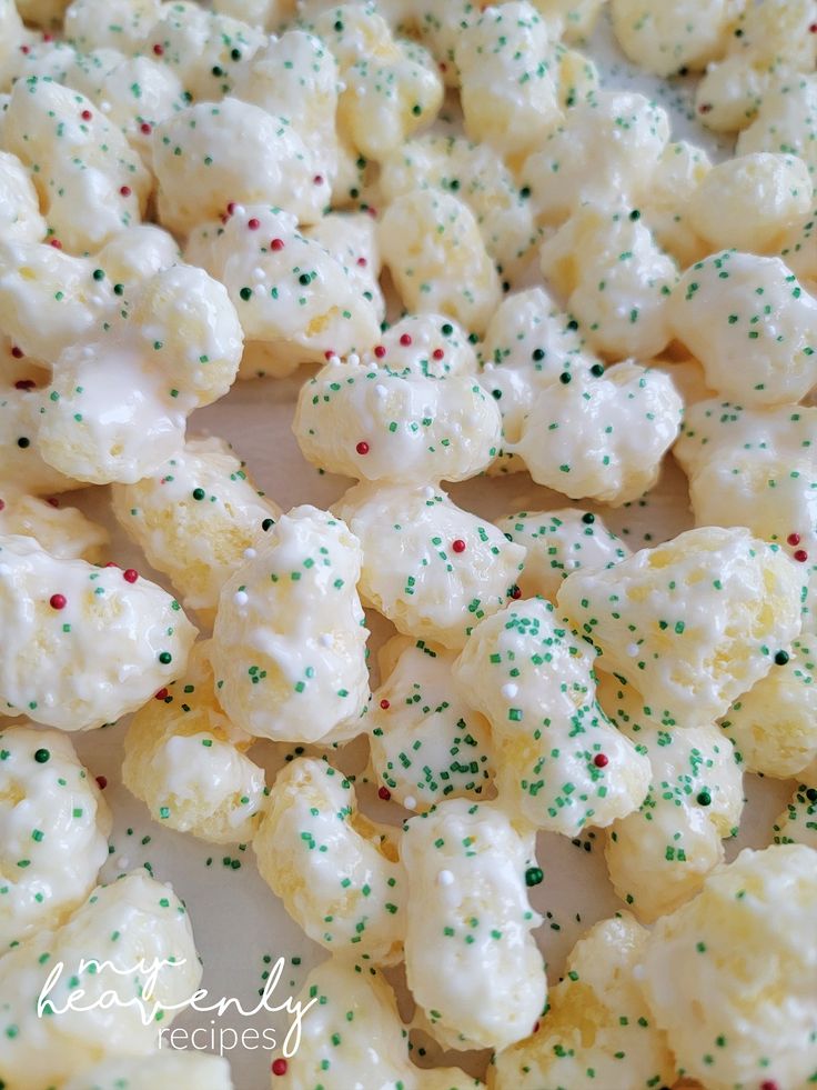 white and green sprinkles are on top of popcorn