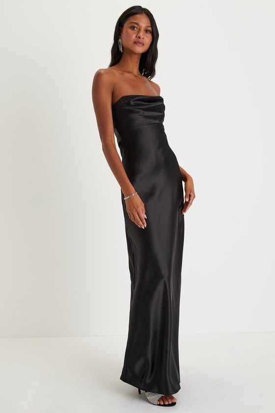 You'll be the classiest invite of the night in the Lulus Exquisite Shine Black Satin Rhinestone Strapless Maxi Dress! Sleek woven satin shapes this luxurious dress that features a strapless bodice with a rhinestone-trimmed sweetheart neckline (with hidden no-slip strips) that peaks out from a cute foldover detail. The figure-flattering slip silhouette falls to an elegant maxi hem. Hidden side zipper/clasp. Fit: This garment fits true to size. Length: Floor length. Size medium measures 52.25" fro Elegant Strapless Dress With Satin Finish For Formal Occasions, Elegant Formal Strapless Dress With Satin Finish, Elegant Strapless Satin Party Dress, Sleek Satin Gown For Night Out, Sleek Satin Evening Gown, Strapless Satin Finish Evening Dress For Formal Occasions, Strapless Silk Evening Dress For Parties, Elegant Strapless Gown With Satin Finish, Formal Strapless Dress With Satin Finish And Fitted Bodice