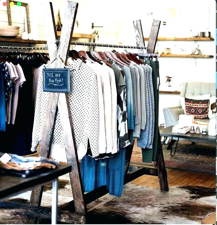 an image of clothes on racks in a store