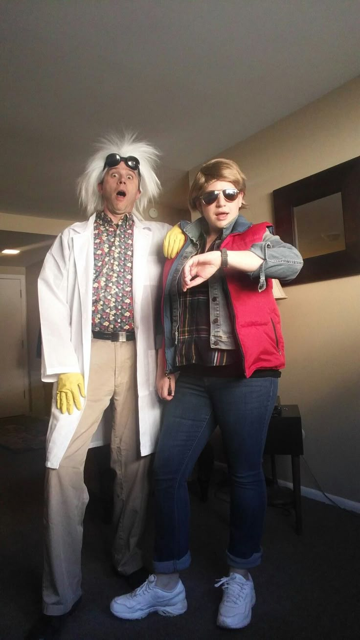 two people dressed up as characters from the movie back to the future standing next to each other