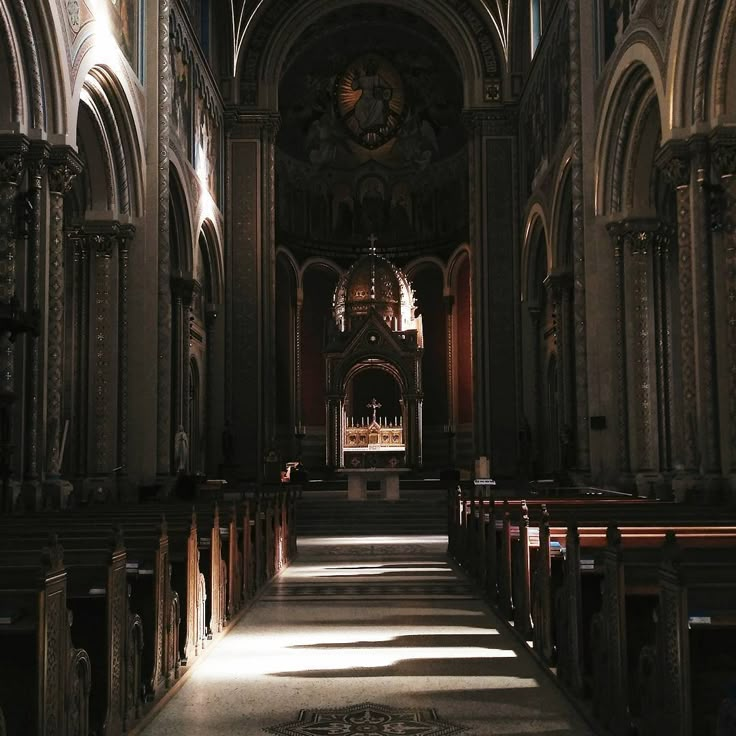 the inside of an old church with pews