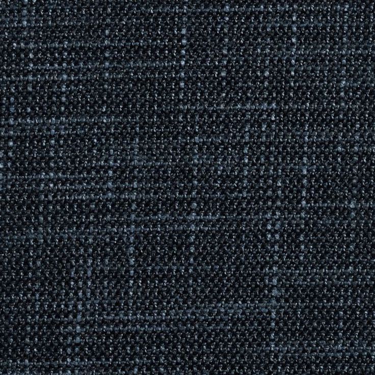 a close up view of a blue and white checkered tweed fabric textured with small dots