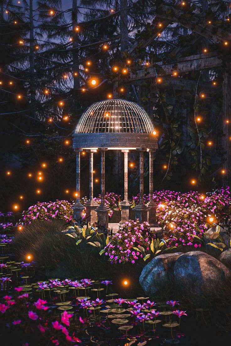 a gazebo surrounded by purple flowers and lit up lights in the night time sky