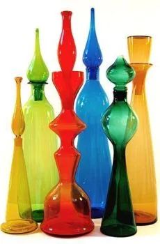 several different colored vases sitting next to each other