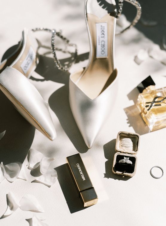 wedding accessories including shoes, ring and perfume