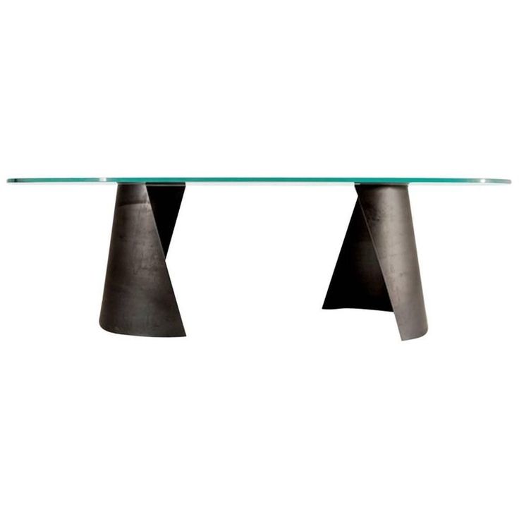 a glass table with two metal legs on each side and an oval top in the middle