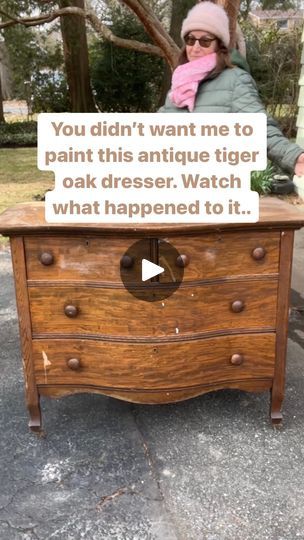 a woman sitting on top of a wooden dresser with a sign that says you didn't want me to paint this antique tiger oak dresser watch what happened to it