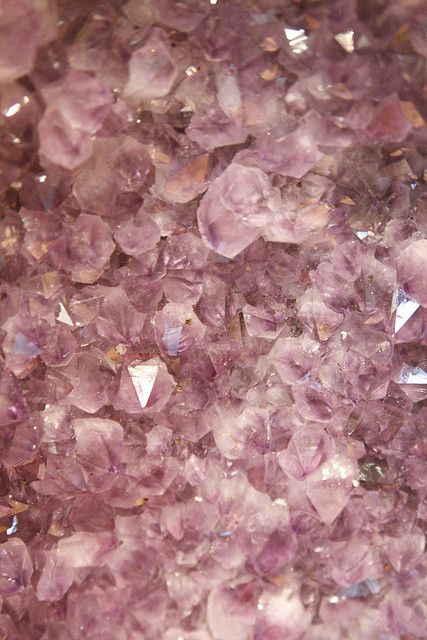 some very pretty pink crystals on a table