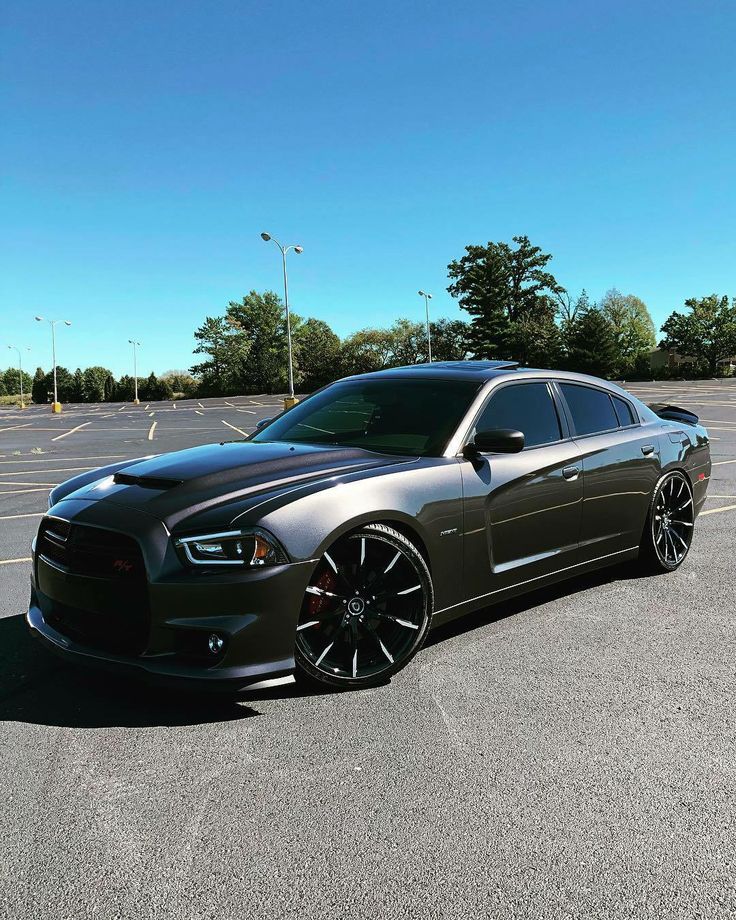 a black car parked in a parking lot