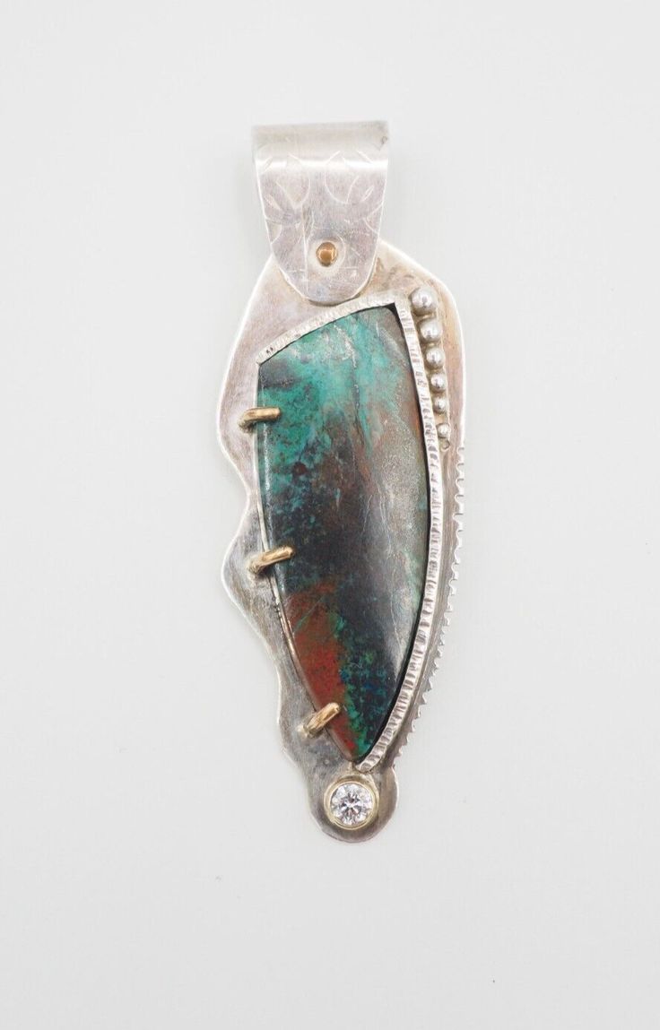 Listing is for Contempoary Art Studio Designer Sterling Silver Chrysocolla 14k gold Architectural Pendant. Beautifully crafted, Art Studio Designer piece, circa 2017. Marked sterling and 14k gold. Pendant measures 2.8" x 0.9". Weight is 21.8 grams. The stone is possibly Zirconium.    Good vintage condition! Thank you. (N121) Domestic Shipping is $6.00,  International is $17.00. Combined shipping is available. Payment must be received 3 days after the sale date. Handmade Stone Jewelry, Antique Jewelry Necklace, Jewelry Inspo, Jewelry Designs, Stone Jewelry, Vintage Watches, Gold Pendant, Art Studio, Jewelry Inspiration