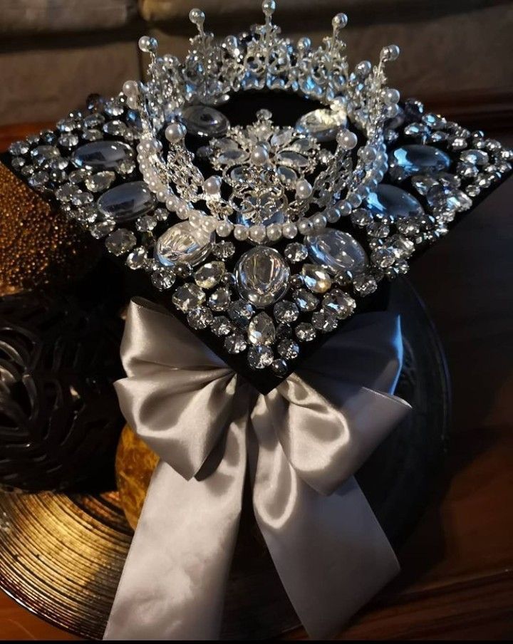 a tiara sitting on top of a black plate