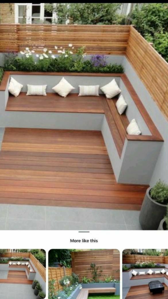 an outdoor seating area with wooden benches and plants