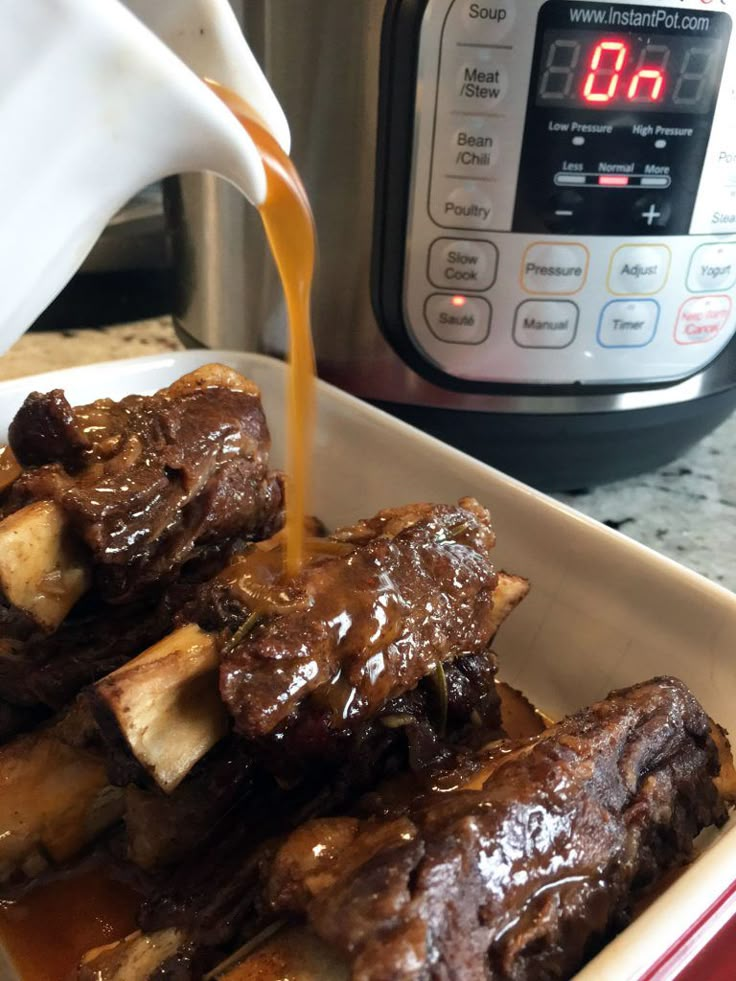 the meal is being prepared in the instant pot with beef ribs and potatoes on it