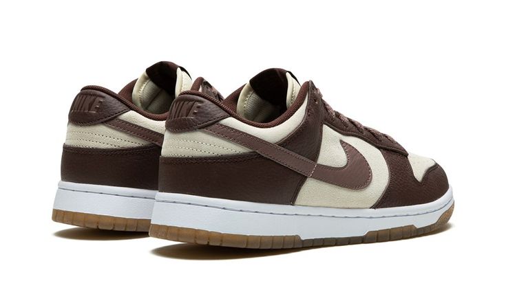 The Women’s Nike Dunk Low “Plum/Coconut Milk” is a women’s-exclusive colorway of the popular retro basketball shoe with a versatile appearance.  Since returning in 2020, the Dunk has been one of the most desirable and collaborated-on sneakers in the industry.  Colorways such as the “Plum/Coconut Milk” bring a casual look to the venerable silhouette.  The shoe features Coconut Milk suede on its base and Plum leather on its overlay panels and Swoosh.  A tonal “Nike” logo appears on the heel.  An a Shoes Wishlist, Nike Zoom Air, Sneakers Box, Outfit Inso, Kobe Shoes, Retro Basketball, All Nike Shoes, Digital Closet, Cute Nike Shoes