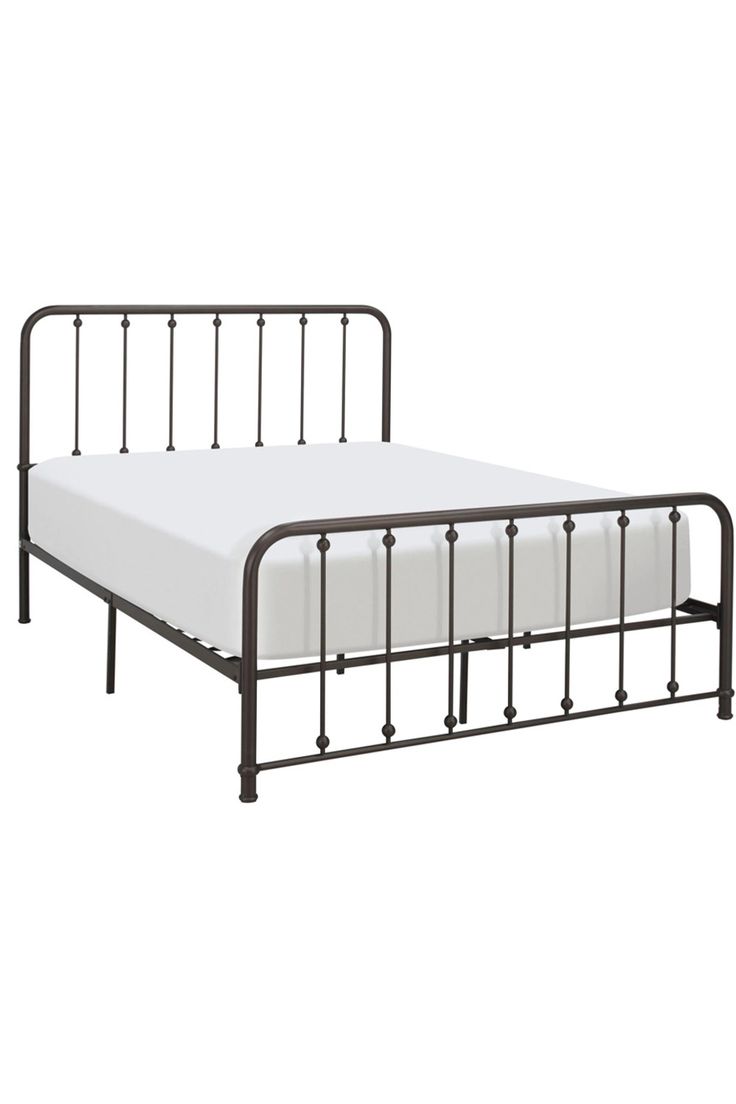 a metal bed frame with white sheets and no headboard or foot board is shown