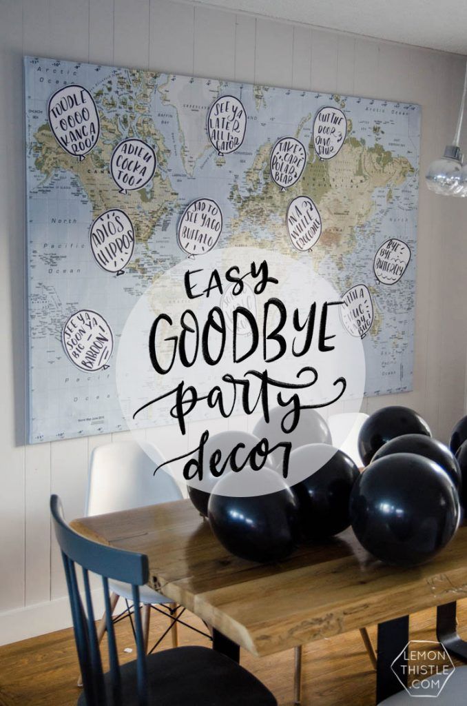 a table with black balloons on it and the words easy goodbye party decor above it