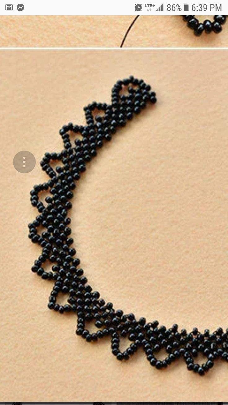 an image of beaded necklace being made