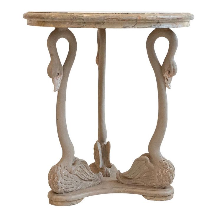 a small table with two flamingos on it's legs and an oval top