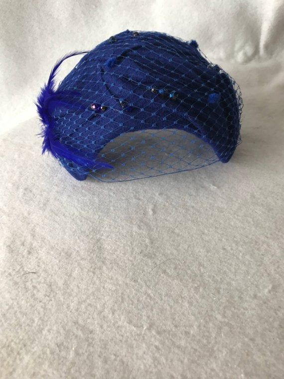 This is a classy Royal Blue wool felt half hat with a modern touch perfect as a fascinator hat, wedding hat, tea party hat, church hat or any other formal special occasion. This is a Royal Blue felt headpiece create by hand and has a wire base that can fit any head size comfortably. WHAT MAKES THIS SO UNIQUE I form each piece while on my head to see how it fits and looks and then take it off and hand sew each piece. I design it to wear both ways so there's no front or back. Light-weight and cool Blue Formal Winter Hat, Formal Blue Winter Hat, Blue Felt Hat With Short Brim For Party, Blue Short Brim Felt Hat For Party, Adjustable Blue Mini Hat For Winter, Adjustable Blue Winter Mini Hat, Adjustable Blue Mini Winter Hats, Blue Curved Brim Felt Hat For Party, Blue Curved Brim Felt Hat For Parties