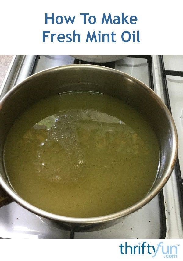 a pot full of fresh mint oil sitting on top of a gas stove with the words how to make fresh mint oil