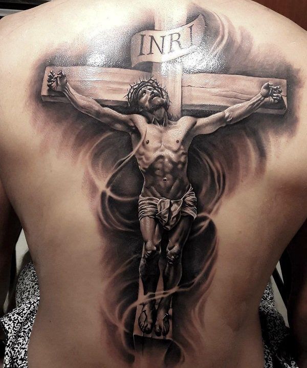 a man with a cross tattoo on his back