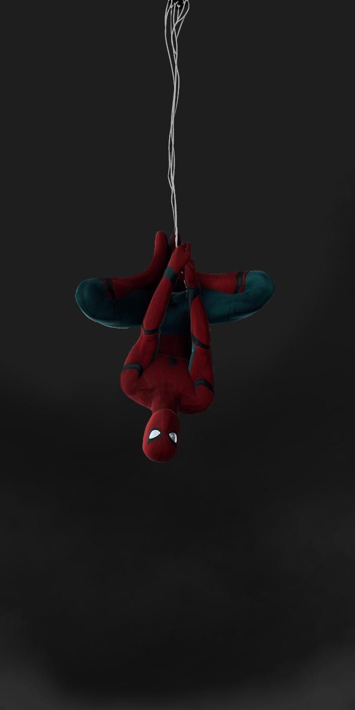 a spiderman stuffed animal hanging from a string