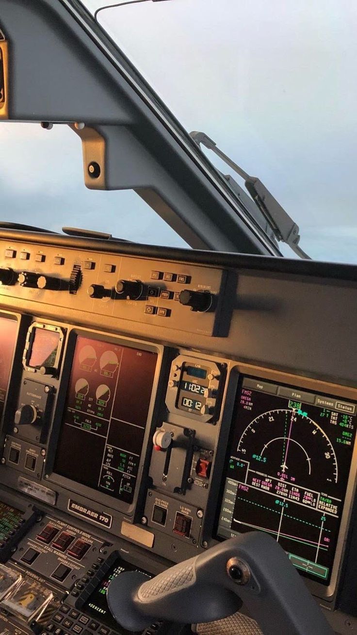 the cockpit of an airplane with multiple controls