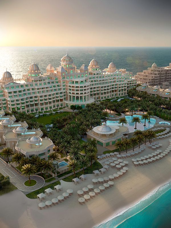 an aerial view of the resort and beach