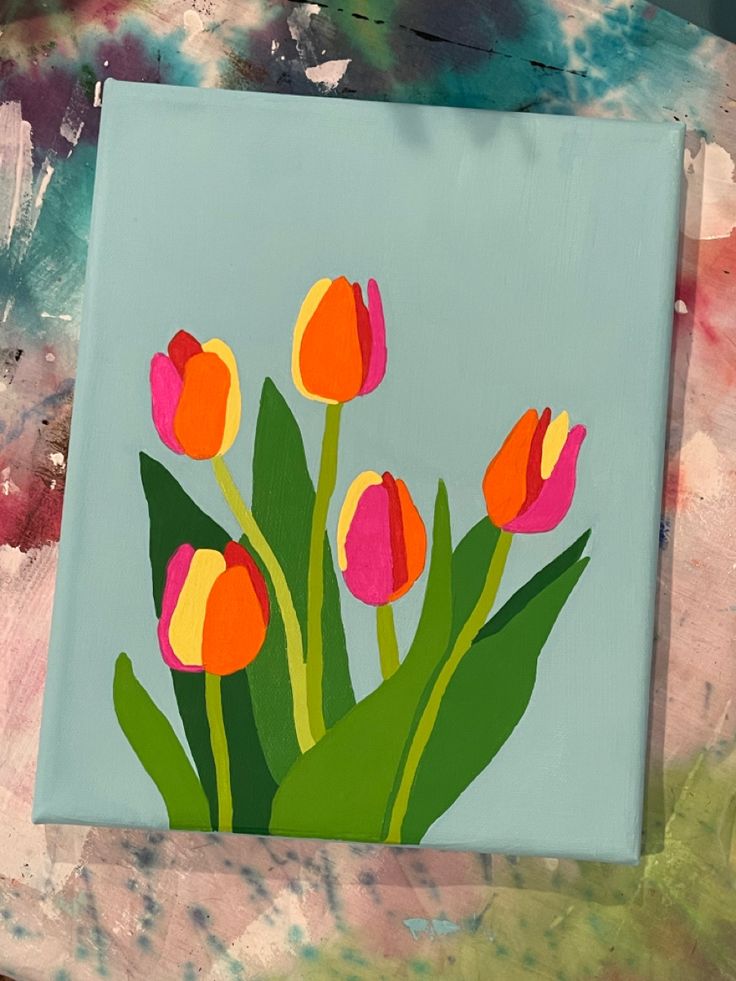 a painting of tulips on a blue background