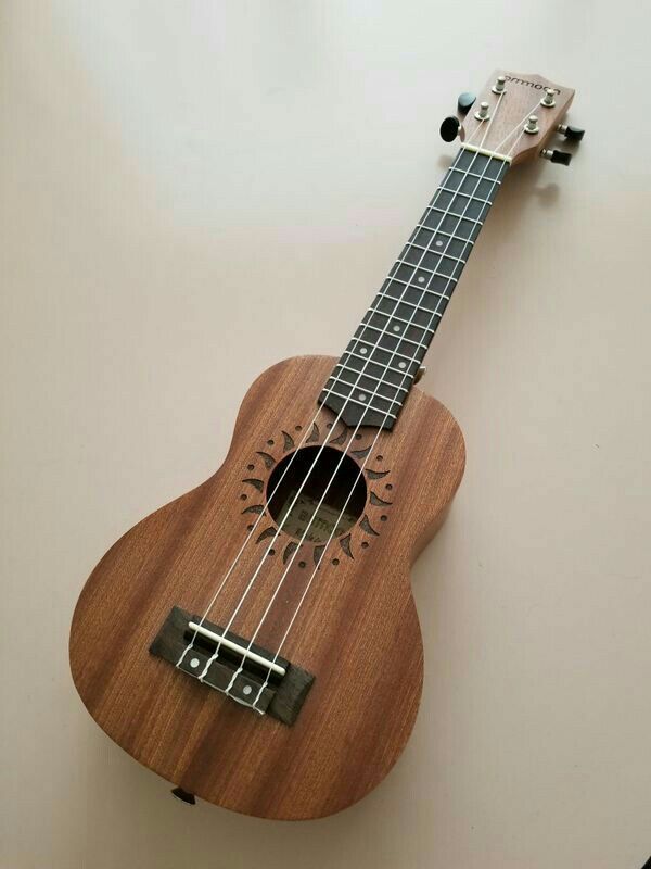 a small ukulele sitting on top of a table