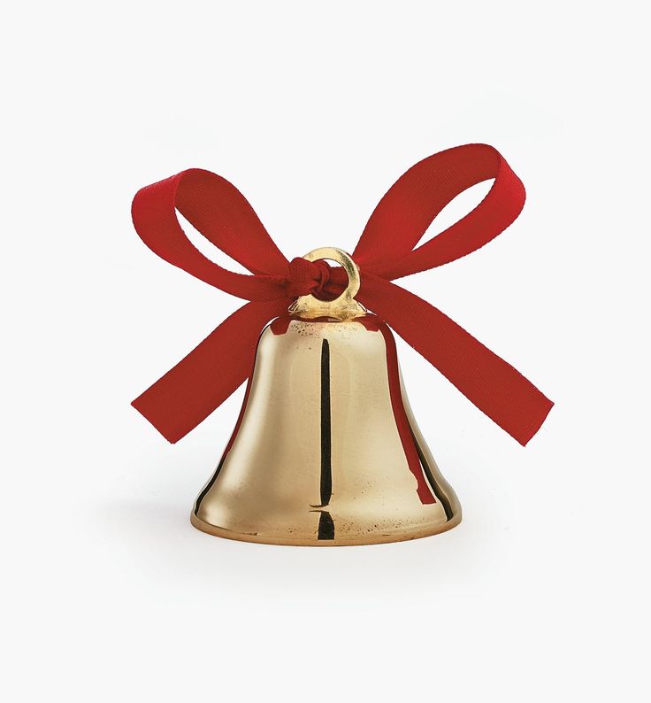 a golden bell with a red bow on it