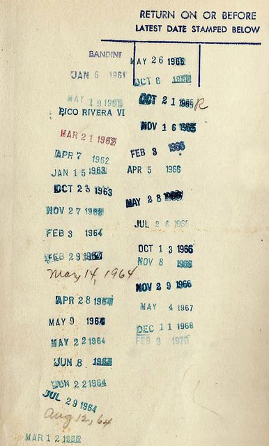 an old paper with some type of date sheet on it's back side in blue ink