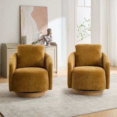 two chairs sitting on top of a rug in a living room