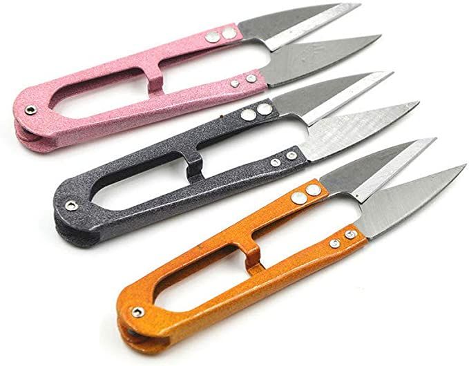 four different types of knives on a white surface