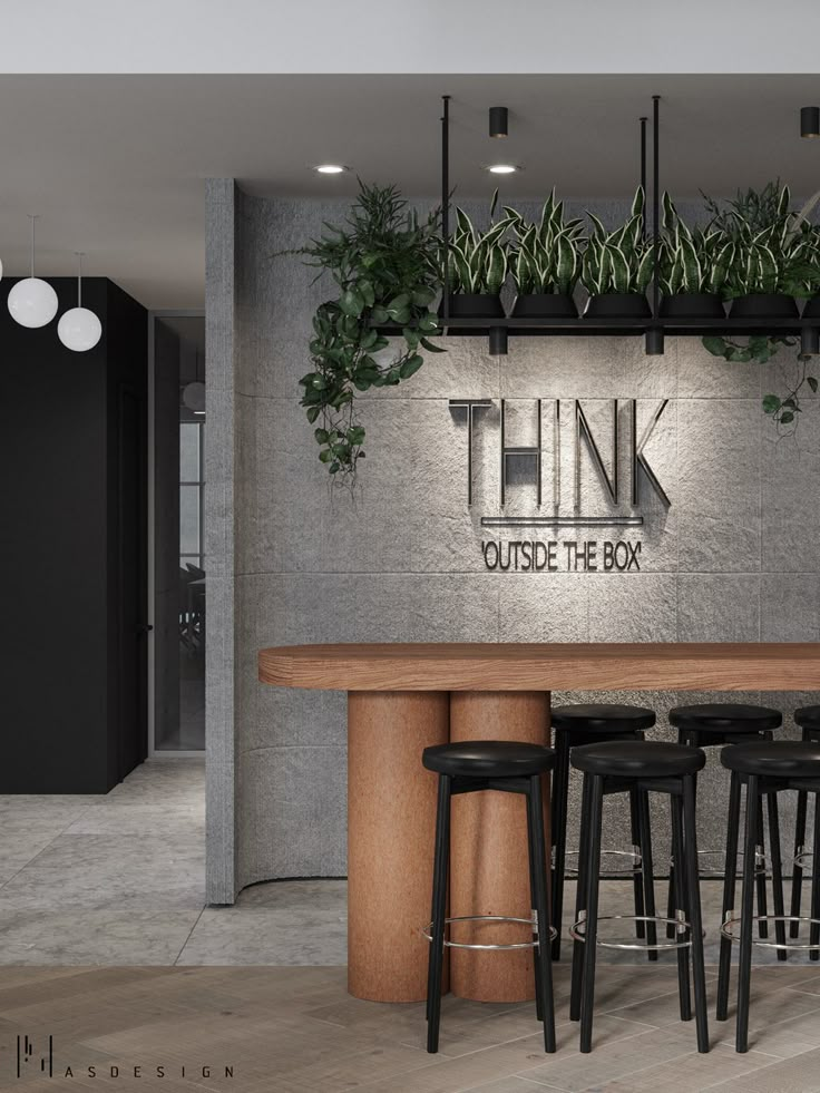 the think outside the box sign is lit up in front of some bar stools