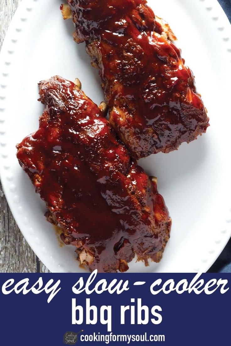 two pieces of bbq ribs on a white plate with the words easy slow cooker bbq ribs