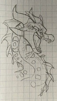 a drawing of a dragon with its mouth open and eyes closed, on a sheet of paper