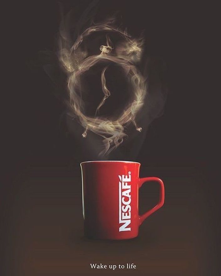 a red coffee cup with steam rising out of it