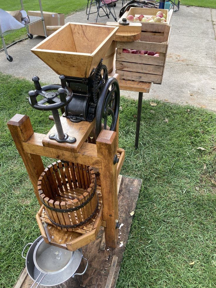 an old fashioned machine sitting on top of a wooden crate