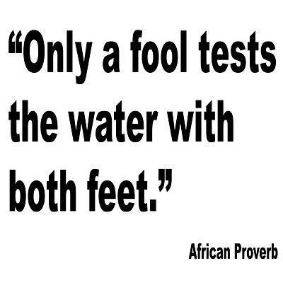 a black and white photo with the words, only a fool tests the water with both feet