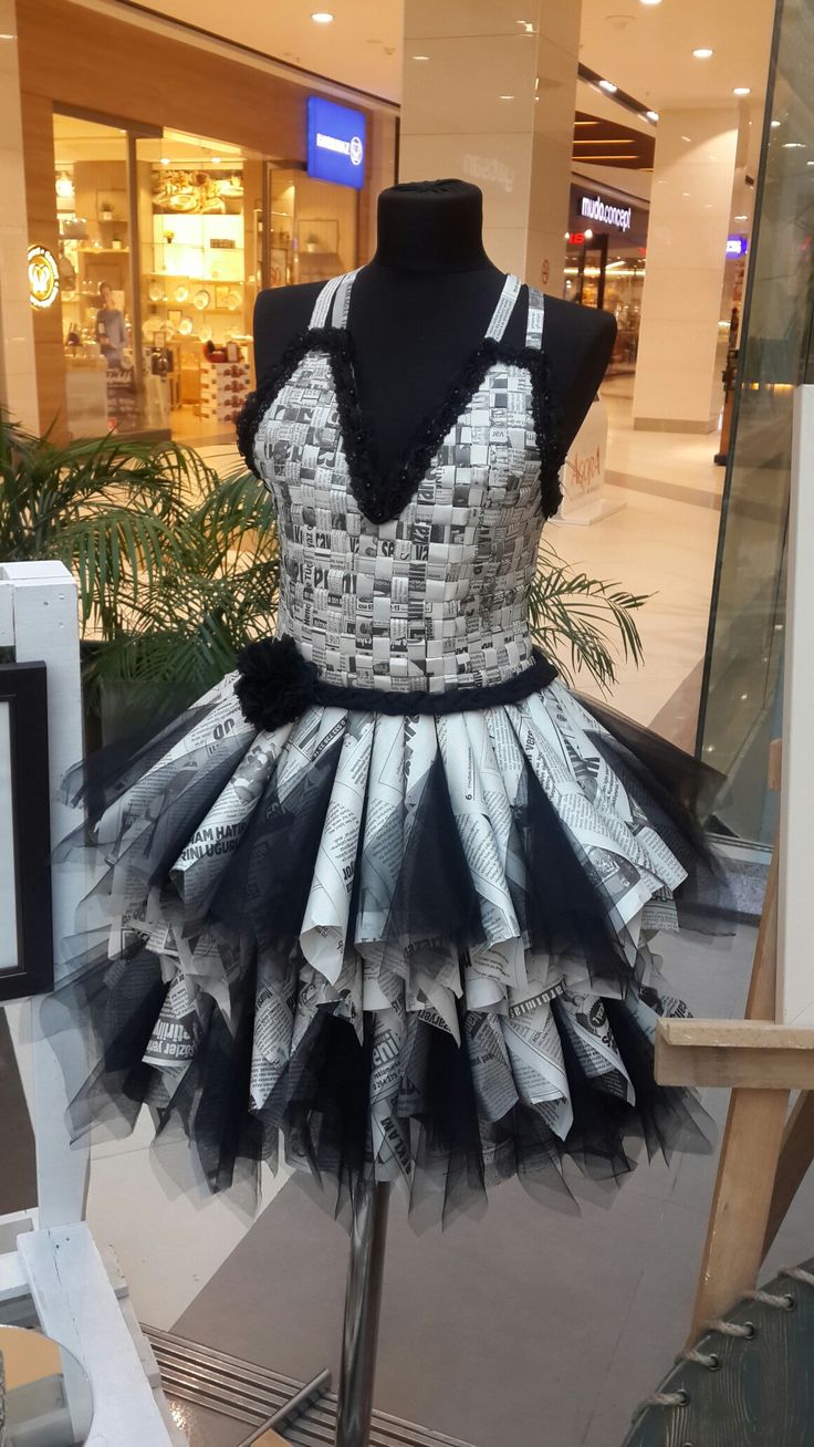 a dress made out of newspaper is on display