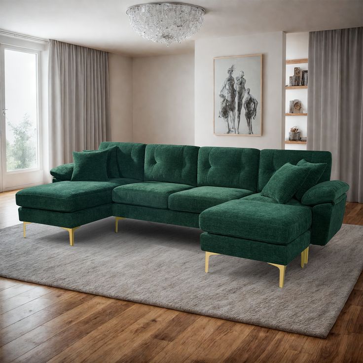 a green couch sitting on top of a wooden floor next to a large white rug