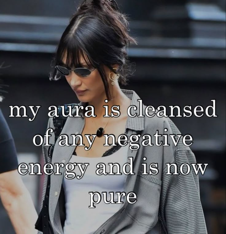 a woman in sunglasses and a jacket with the words, my aura is cleansed of any negative energy and is now pure