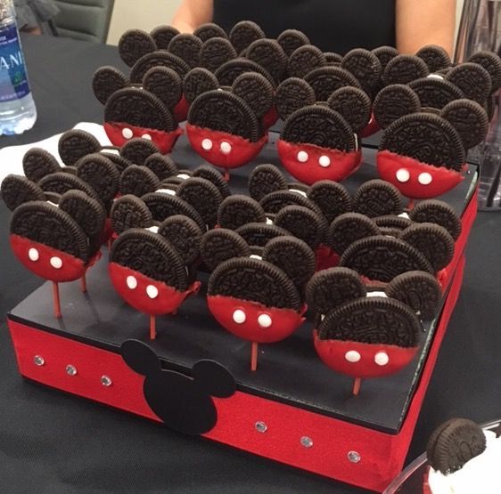 there are many oreo cookies in the shape of mickey mouses on top of each other