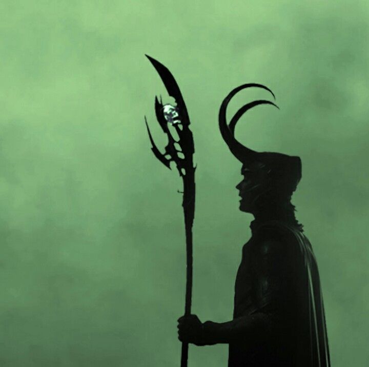 a silhouette of a man holding a sceptacle and wearing a horned headdress