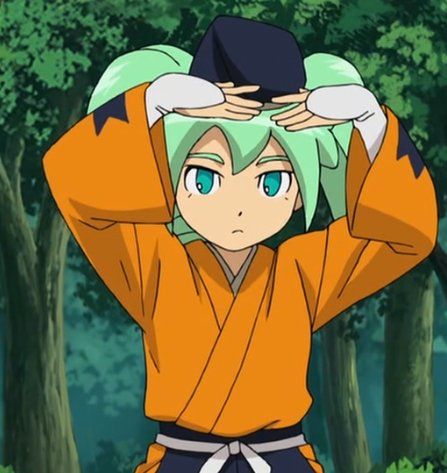 an anime character with green hair and blue eyes holding his hands up to his head