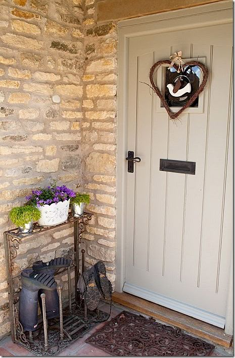 a front door with a potted plant next to it