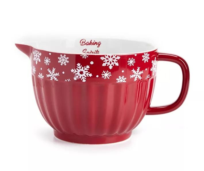 a red and white cup with snowflakes on it