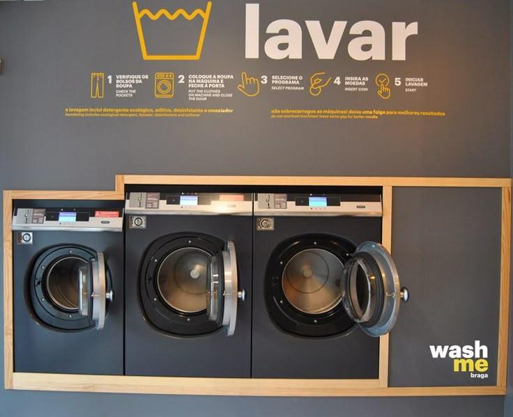 a washer and dryer are on display in front of a sign that says lavar